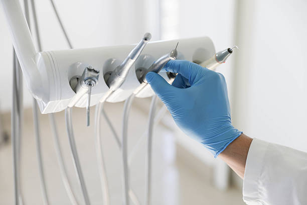 Professional Root Canal Treatment technician working in West Hills, NY